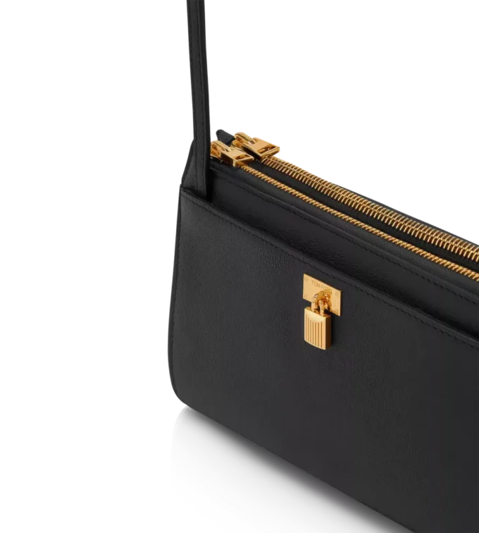 Mini-Tasche aus naturbelassenem Leder mit Vorhängeschloss und Riemen Mini-Tasche aus naturbelassenem Leder mit Vorhängeschloss und Riemen