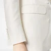 Zweireihige Jacke aus Wolle und Seide mit Schattenstreifen und Spitzkragen Zweireihige Jacke aus Wolle und Seide mit Schattenstreifen und Spitzkragen